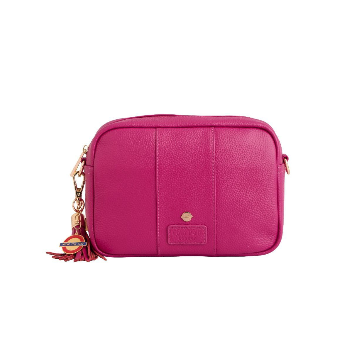 Pink leather crossbody bag with a tassel on a white background