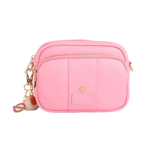 Pink crossbody bag with a keychain on a white background